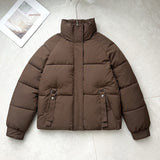 Damen kurze gesteppte Pufferjacke mit hohem Stehkragen und D-Ring-Tasche