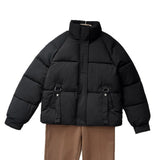 Damen kurze gesteppte Pufferjacke mit hohem Stehkragen und D-Ring-Tasche