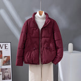 Damen kurzer Steppblouson mit hoher Kragenblende und Pattentaschen