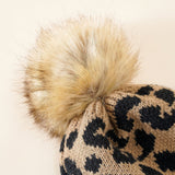 Damen Strickmütze mit Leopardenmuster und Kunstfell-Pompon